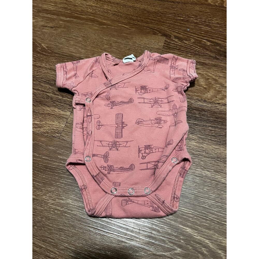 Kate Quinn Airplane print onesie